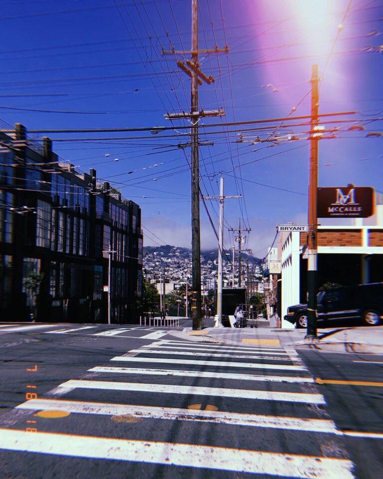crosswalk lines and overhead power lines at city intersection in San Francisco