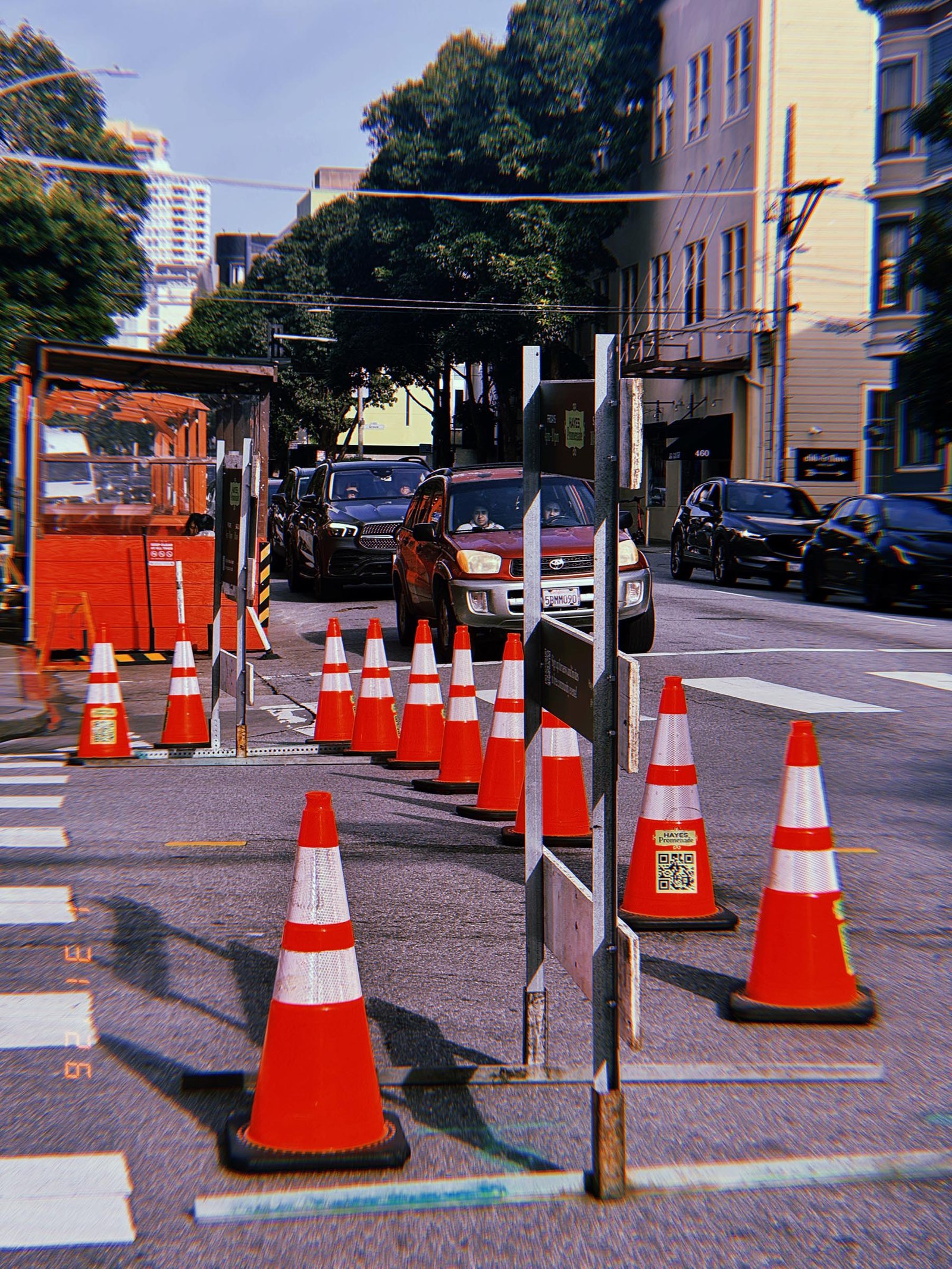 traffic cones arranged to redirect vehicles through a street work zone
