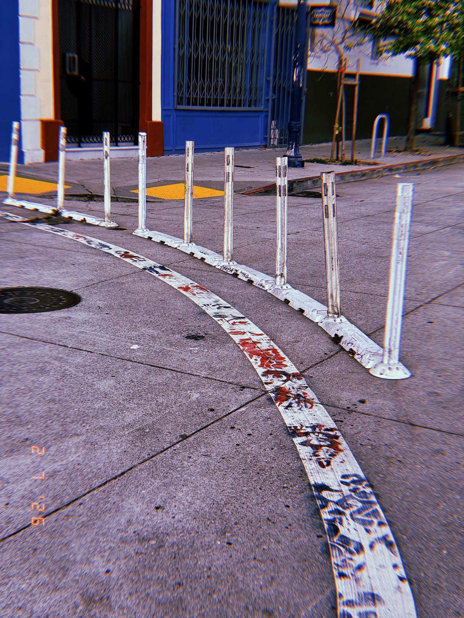 flexible lane divider posts installed along a curved street marking