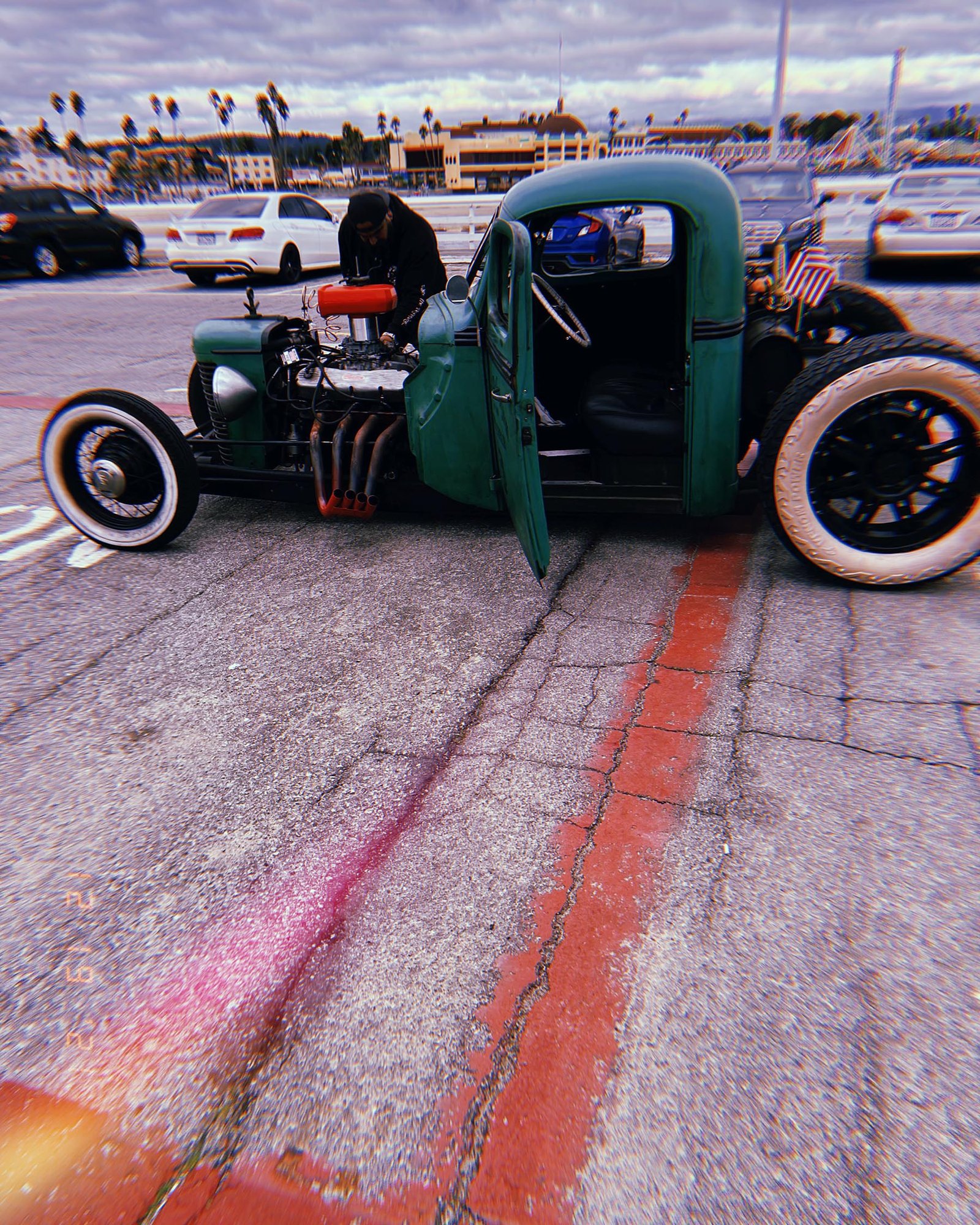 custom vintage hot rod car parked in waterfront parking lot in San Francisco