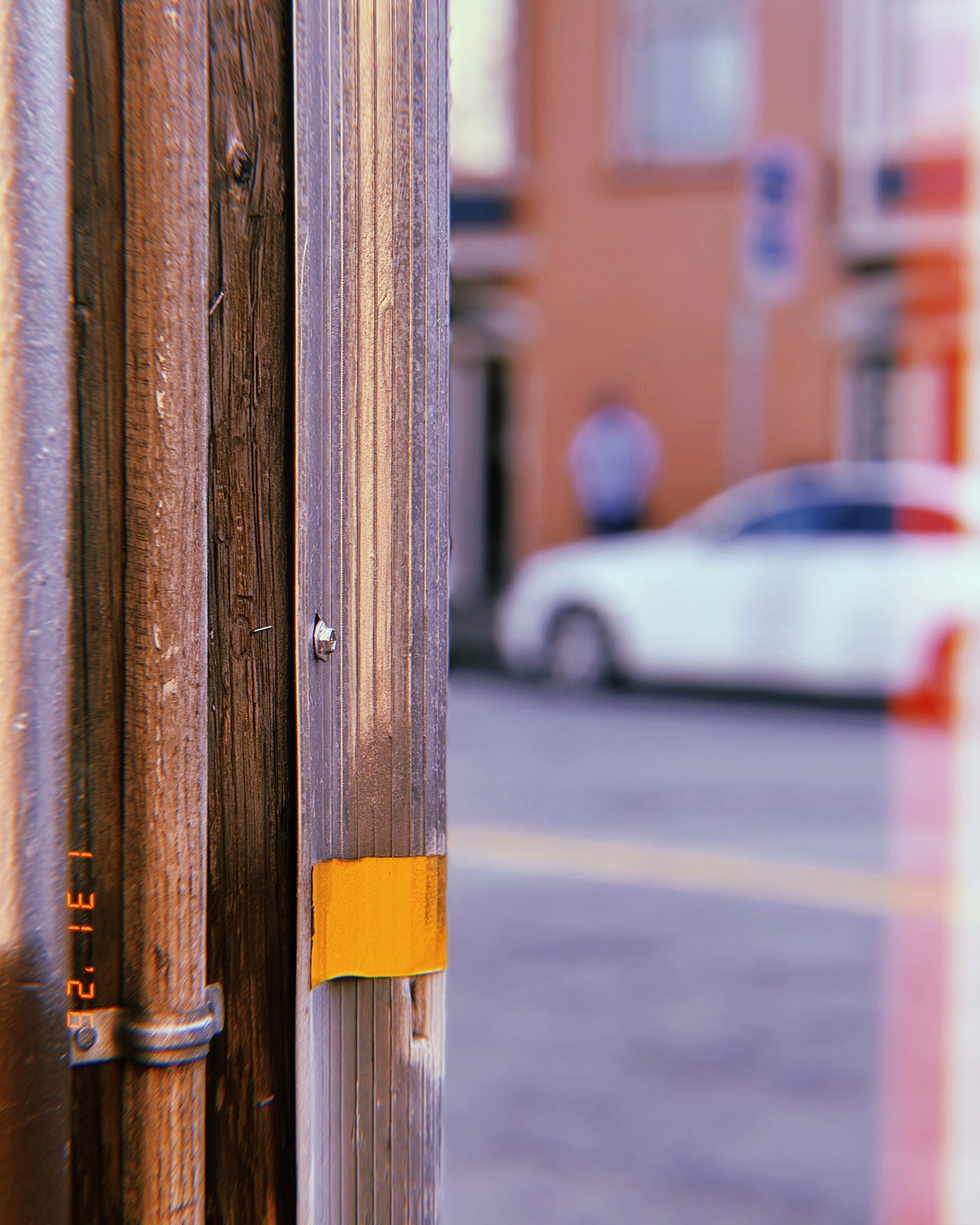 utility conduit and cable mounted on wooden street pole