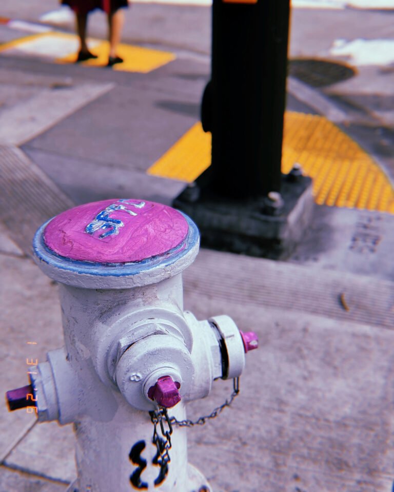 fire hydrant with painted cap installed at street corner
