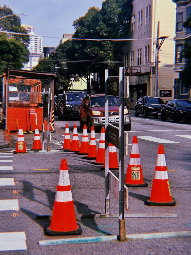 traffic cones arranged to redirect vehicles through a street work zone