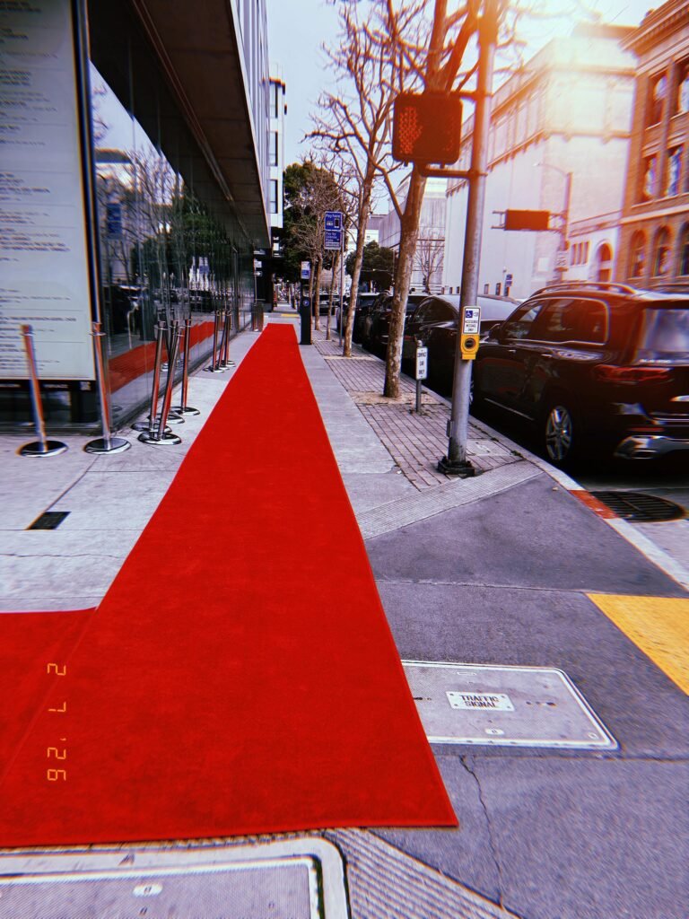 red carpet temporarily covering a section of city sidewalk