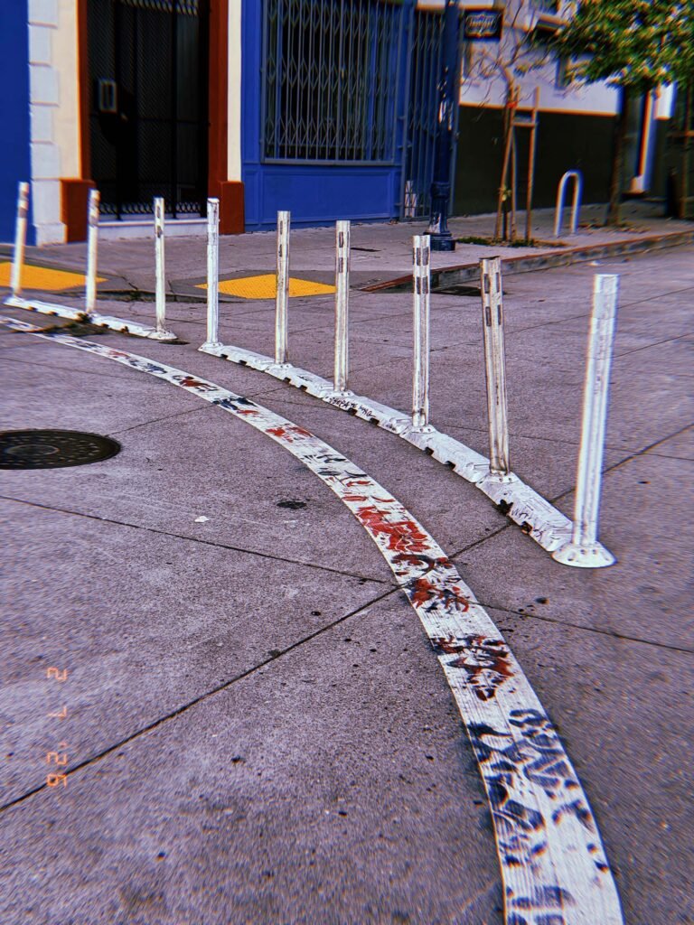 flexible lane divider posts installed along a curved street marking