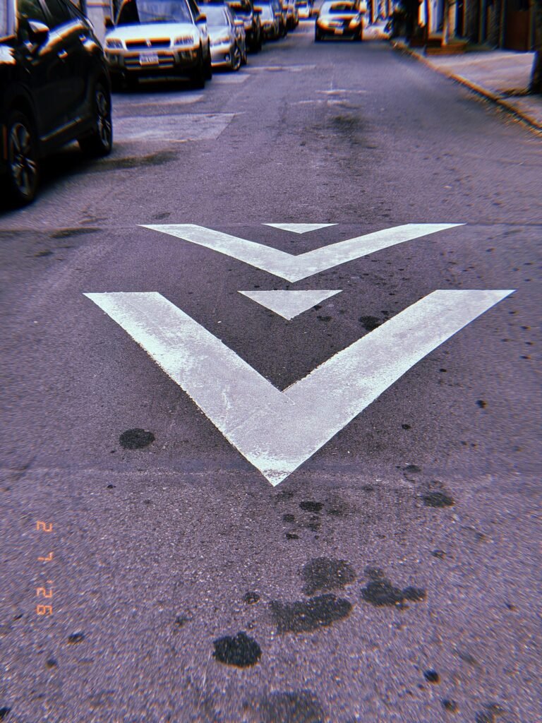 directional arrows painted on the center of a city street