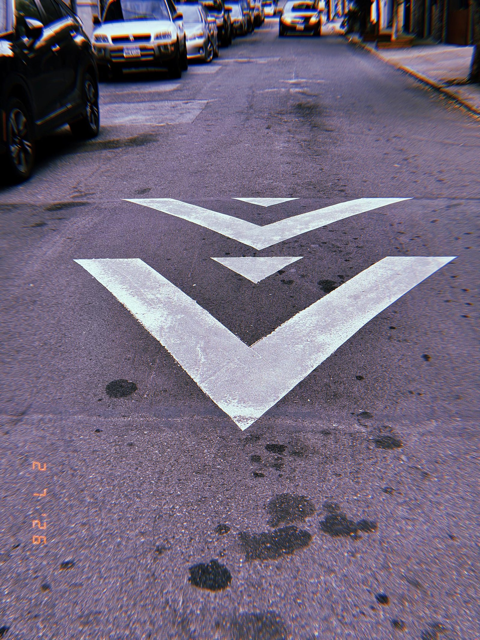 directional arrows painted on the center of a city street