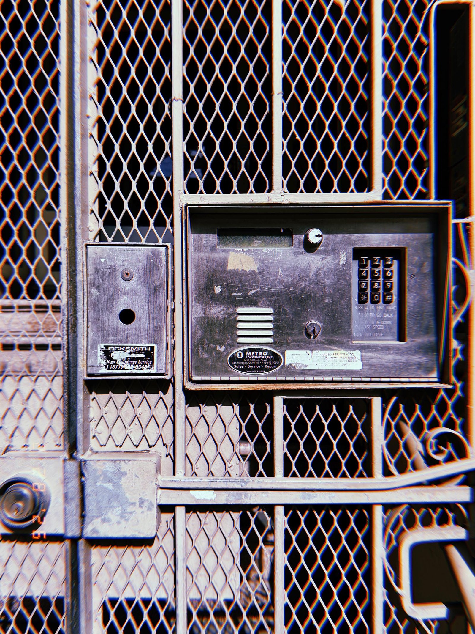 metal gate access control panel with keypad and intercom mounted on security gate